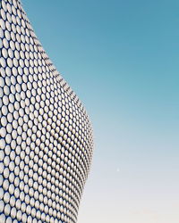 Low angle view of modern building against clear sky