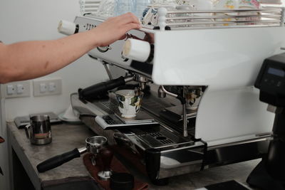 Close-up of hands working at table