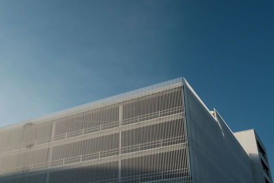 Low angle view of modern building against clear sky