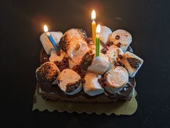 Burning candles on cake