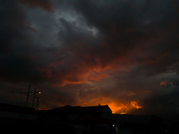 Low angle view of dramatic sky during sunset