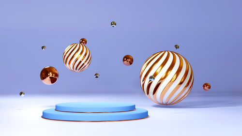 Close-up of balloons against blue sky