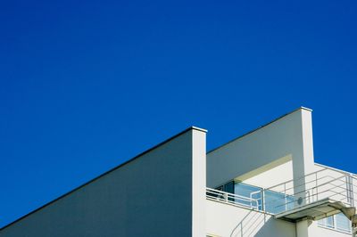 Low angle view of building against clear blue sky