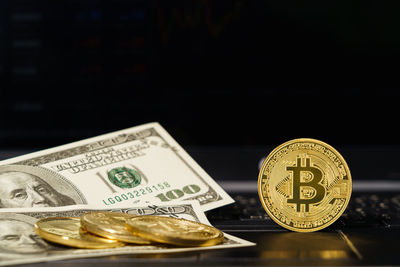 Close-up of coins on black background