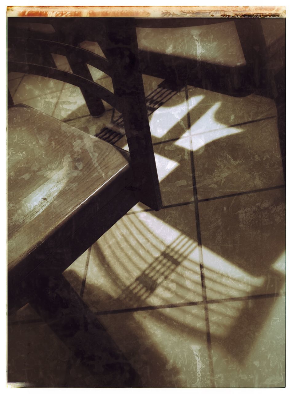 transfer print, indoors, auto post production filter, high angle view, tiled floor, flooring, shadow, empty, absence, sunlight, table, home interior, no people, tile, reflection, floor, close-up, pattern, steps, chair