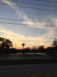 Road against cloudy sky at sunset