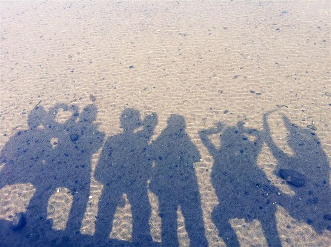 high angle view, shadow, sand, sunlight, focus on shadow, outdoors, day, footprint, textured, text, western script, love, communication, wall - building feature, pattern, beach, street, close-up