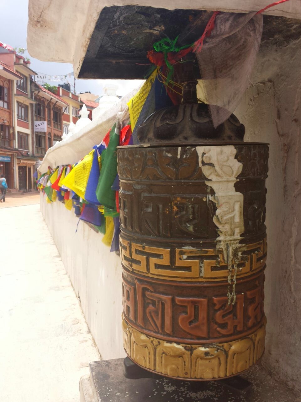 CLOSE-UP OF MULTI COLORED BUILDING HANGING OUTSIDE TEMPLE