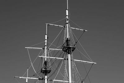 Low angle view of sailboat against clear sky