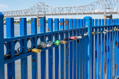 Metallic bridge against blue sky