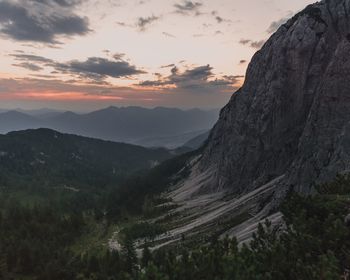 Scenic view of mountains against sky at sunset