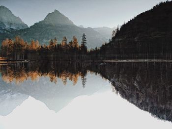 Scenic view of lake and mountains against sky