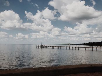 Pier over sea against sky