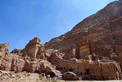 Low angle view of rock formations against sky