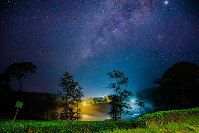 Scenic view of field against sky at night