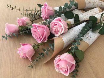 High angle view of pink roses on table