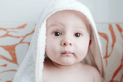 Cute baby boy wearing towel