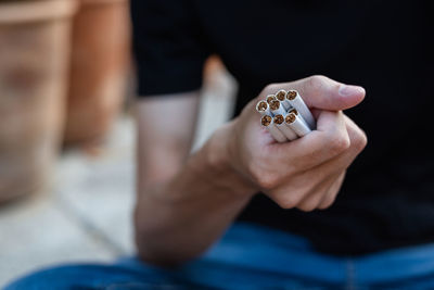 Close-up of man holding hands