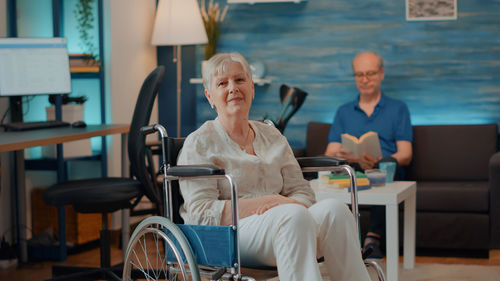 Portrait of disabled senior woman at home