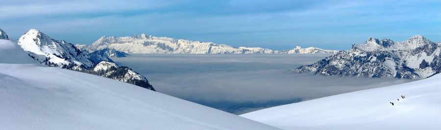 Scenic view of snow covered mountains