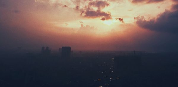 Aerial view of city during sunset