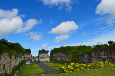 Ruins of building against cloudy sky