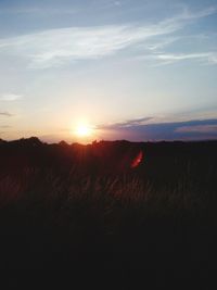 Scenic view of landscape at sunset