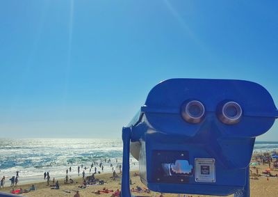 View of sea against clear blue sky