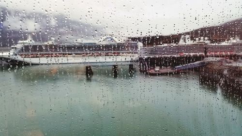 Raindrops on glass window during rainy season