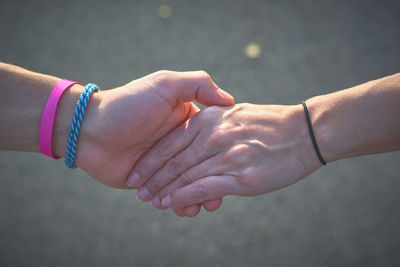 Cropped hand of man holding hands