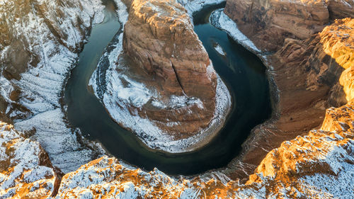 Aerial view of rock formation amidst river in desert