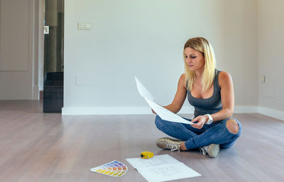 Young woman sitting at home