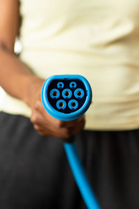 Close-up of man holding camera