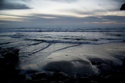 Scenic view of sea at sunset