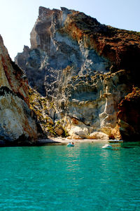 Scenic view of sea and rock formation against sky