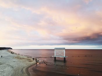 Scenic view of beach against sky during sunset