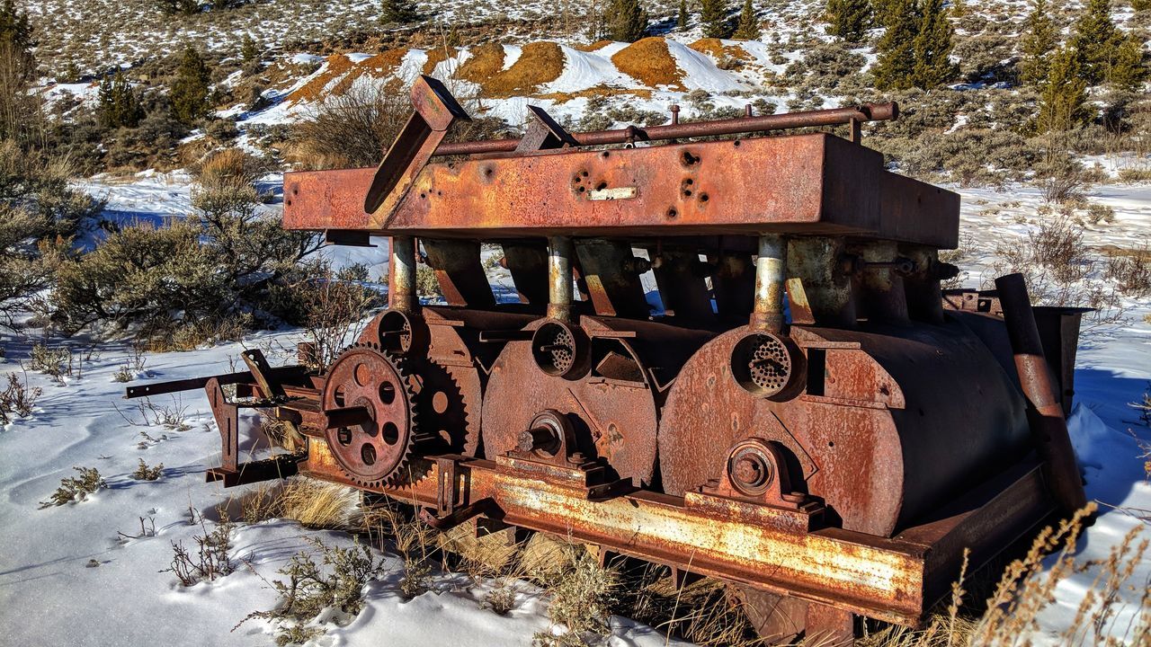 ABANDONED TRAIN ON SNOW COVERED RAILROAD TRACK