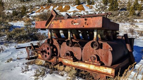 Abandoned train on railroad tracks during winter