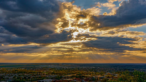 Aerial view of townscape against sky during sunset