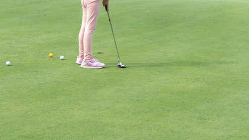 Low section of person playing with ball