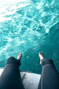 Low section of man in swimming pool