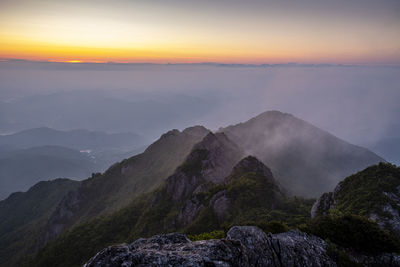 Scenic view of mountains against sky during sunset