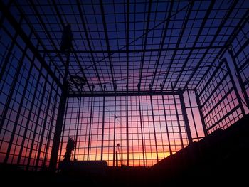 Low angle view of silhouette ceiling against sky