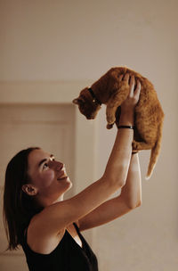 Portrait of young woman with dog