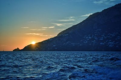 Scenic view of sea against sky during sunset