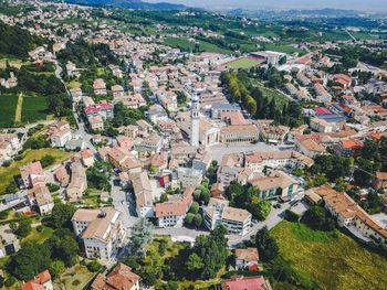High angle view of houses and trees in town