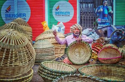 Portrait of a smiling young woman sitting in basket