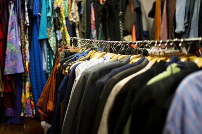 Clothes hanging in rack for sale at market