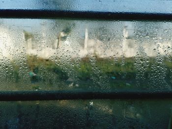 Close-up of raindrops on glass window