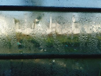 Close-up of raindrops on glass window